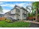 Beautiful home exterior with a lush green lawn, patio area, and a charming deck; great for outdoor gatherings at 3918 N Park Ave, Indianapolis, IN 46205