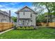 Spacious backyard featuring a lush green lawn, a charming deck, and patio seating area; ideal for relaxation at 3918 N Park Ave, Indianapolis, IN 46205