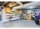 Unfinished basement offering plenty of storage and potential for future customization with shelving at 3918 N Park Ave, Indianapolis, IN 46205