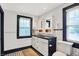 Well-lit bathroom with double sinks, elegant tile work, and ample storage space for modern living at 3918 N Park Ave, Indianapolis, IN 46205