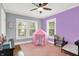 Charming bedroom features colorful walls, hardwood floors, and bright windows for a cheerful space at 3918 N Park Ave, Indianapolis, IN 46205