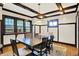 Elegant dining room with hardwood floors, coffered ceiling, and stylish lighting at 3918 N Park Ave, Indianapolis, IN 46205