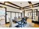 Classic dining room with wood floors, detailed trim, and an open floor plan to adjacent rooms at 3918 N Park Ave, Indianapolis, IN 46205