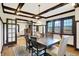 Traditional dining room with coffered ceilings, wood floors, and a large dining table at 3918 N Park Ave, Indianapolis, IN 46205