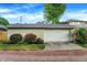 A detached two-car garage with a brick driveway, complimented by lush landscaping and an easy to read address at 3918 N Park Ave, Indianapolis, IN 46205