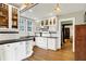 Bright kitchen with white cabinets, black countertops, subway tile backsplash, and stainless steel appliances at 3918 N Park Ave, Indianapolis, IN 46205