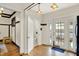 View of a kitchen with white cabinets and a door leading to the backyard at 3918 N Park Ave, Indianapolis, IN 46205