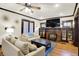 Comfortable living room featuring a fireplace, hardwood floors, and stylish decor at 3918 N Park Ave, Indianapolis, IN 46205