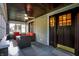 Inviting porch with comfortable seating, ceiling fan, and views of the neighborhood at 3918 N Park Ave, Indianapolis, IN 46205