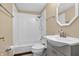 Bathroom featuring a shower and bathtub combination, toilet, sink, and a mirror at 4154 W Briarwood Lake S Dr, Monrovia, IN 46157