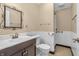 Bathroom with decorative mirror, a sink, and toilet at 4154 W Briarwood Lake S Dr, Monrovia, IN 46157