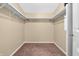 Walk-in closet with carpet, shelving, and rod for ample storage at 4154 W Briarwood Lake S Dr, Monrovia, IN 46157