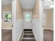 Bright entryway featuring wainscoting and views to adjacent rooms at 4154 W Briarwood Lake S Dr, Monrovia, IN 46157