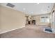 Open-concept living room showcases neutral walls, carpeting, and an eat-in kitchen space with modern appliances at 4154 W Briarwood Lake S Dr, Monrovia, IN 46157