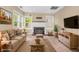 Living room showcases a fireplace, comfortable seating, and bright natural light at 4154 W Briarwood Lake S Dr, Monrovia, IN 46157