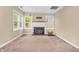 Cozy living room with a fireplace and large windows offering lots of natural light at 4154 W Briarwood Lake S Dr, Monrovia, IN 46157