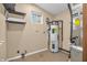 Utility room featuring a water heater, shelving, and furnace at 4154 W Briarwood Lake S Dr, Monrovia, IN 46157