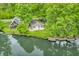Tranquil water view featuring waterfront homes and lush trees along the shoreline at 4154 W Briarwood Lake S Dr, Monrovia, IN 46157
