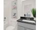 Modern bathroom with gray vanity, black countertop, and stylish decor at 4159 Persian St, Greenwood, IN 46143