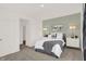 Comfortable bedroom with a bed, a dresser, lamps, and natural light from windows at 4159 Persian St, Greenwood, IN 46143
