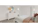 Bright bedroom with a white dresser, decorative mirror and comfortable bed, designed for relaxation at 4159 Persian St, Greenwood, IN 46143