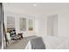 Bright bedroom with large windows, a comfortable chair, and a view of the outside at 4159 Persian St, Greenwood, IN 46143