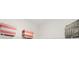 Organized closet features coral striped storage bins and neatly hanging gray dresses, maximizing storage space at 4159 Persian St, Greenwood, IN 46143