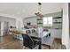 Open kitchen with stainless steel appliances, a breakfast bar, a dining table, and light green paint at 4159 Persian St, Greenwood, IN 46143