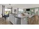 Open kitchen showcasing island, stainless appliances, hardwood floors, and seating at 4159 Persian St, Greenwood, IN 46143