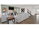 Bright living room featuring a cozy fireplace, hardwood floors, and modern furnishings at 4159 Persian St, Greenwood, IN 46143
