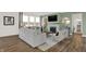Inviting living room with large windows, stylish seating, fireplace and hardwood floors at 4159 Persian St, Greenwood, IN 46143