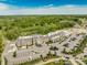 Aerial view of the Holliday Farms community featuring trees, a golf course, and a brick building at 4190 Hartswick Ct, Zionsville, IN 46077