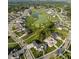 Aerial view of upscale community featuring lush golf course, pond, and luxurious homes at 4190 Hartswick Ct, Zionsville, IN 46077