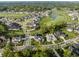 Scenic aerial perspective of a neighborhood with a golf course and tree-lined streets at 4190 Hartswick Ct, Zionsville, IN 46077