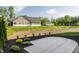 Backyard featuring green lawns, landscaping, and other homes nearby at 4190 Hartswick Ct, Zionsville, IN 46077