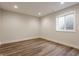 Unfinished basement with wood look flooring and a window at 4190 Hartswick Ct, Zionsville, IN 46077