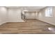 Finished basement with hardwood floors, recessed lighting, and stairs at 4190 Hartswick Ct, Zionsville, IN 46077