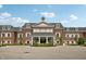 Brick building exterior with covered entrance and manicured landscaping at 4190 Hartswick Ct, Zionsville, IN 46077