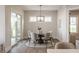 Charming dining room with a modern chandelier, table for six, and sliding glass door to patio at 4190 Hartswick Ct, Zionsville, IN 46077