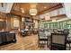 Elegant dining room with wood floors, ample seating, and decorative lighting at 4190 Hartswick Ct, Zionsville, IN 46077