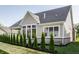Exterior view of home featuring manicured backyard with green trees and grass at 4190 Hartswick Ct, Zionsville, IN 46077