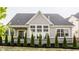 Exterior view of home featuring manicured backyard with green trees and grass at 4190 Hartswick Ct, Zionsville, IN 46077