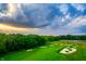 Stunning view of the meticulously maintained golf course featuring lush greenery and bunkers at 4190 Hartswick Ct, Zionsville, IN 46077