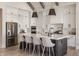 Modern kitchen featuring a large island with seating, sleek appliances, and stylish finishes at 4190 Hartswick Ct, Zionsville, IN 46077