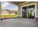 Covered patio with an outdoor view of a large lawn and other properties at 4190 Hartswick Ct, Zionsville, IN 46077