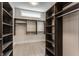Spacious walk-in closet with custom shelving and ample storage space at 4190 Hartswick Ct, Zionsville, IN 46077