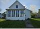 Charming home featuring a quaint front yard and multiple windows at 421 N Canal St, Alexandria, IN 46001
