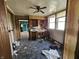 Outdated kitchen with linoleum floors and wooden cabinets needing repair at 421 N Canal St, Alexandria, IN 46001