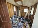 Untidy utility room shows a water heater, sink, and electrical panel at 421 N Canal St, Alexandria, IN 46001