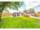 Expansive back yard features a wooden deck, hot tub, storage shed and well-maintained lawn at 433 N 15Th Ave, Beech Grove, IN 46107